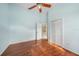 Light and airy bedroom with wood floors and access to another room at 3116 Silkwood Ln, Port Charlotte, FL 33953