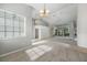 Dining area with high ceilings, chandelier and view to living room at 3116 Silkwood Ln, Port Charlotte, FL 33953