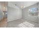 Simple dining area with a chandelier and large window at 3116 Silkwood Ln, Port Charlotte, FL 33953
