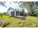 Exterior view of home with screened patio at 3116 Silkwood Ln, Port Charlotte, FL 33953