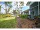 Home exterior showcasing side yard at 3116 Silkwood Ln, Port Charlotte, FL 33953