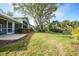 Home exterior showcasing backyard lawn at 3116 Silkwood Ln, Port Charlotte, FL 33953