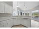 Eat-in kitchen boasts expansive windows and granite countertops at 3116 Silkwood Ln, Port Charlotte, FL 33953