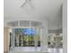 Bright living room with large sliding glass doors leading to a screened patio at 3116 Silkwood Ln, Port Charlotte, FL 33953