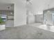 Open living space with neutral color palette and tile flooring at 3116 Silkwood Ln, Port Charlotte, FL 33953