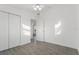 Well-lit bedroom with tile floors and double door closet at 3287 Great Neck St, Port Charlotte, FL 33952