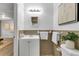Cozy bathroom with classic vanity, white fixtures, decorative accents, and a framed print at 330 45Th S St, St Petersburg, FL 33711