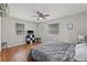 Grey bedroom with hardwood floors and ceiling fan at 330 45Th S St, St Petersburg, FL 33711