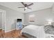 Well-lit bedroom with hardwood floors and ceiling fan at 330 45Th S St, St Petersburg, FL 33711