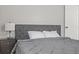 Cozy bedroom with gray bedding and nightstand at 330 45Th S St, St Petersburg, FL 33711