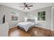 Spacious bedroom with hardwood floors and two windows at 330 45Th S St, St Petersburg, FL 33711