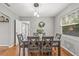 Dining room table with six chairs, wreath, and natural light at 330 45Th S St, St Petersburg, FL 33711