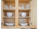 Open cabinets with dishes and glassware at 330 45Th S St, St Petersburg, FL 33711