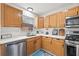 Kitchen boasts stainless steel appliances and light wood cabinets at 330 45Th S St, St Petersburg, FL 33711