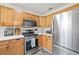 Stainless steel appliances and light wood cabinets in kitchen at 330 45Th S St, St Petersburg, FL 33711