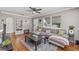 Living room with hardwood floors, gray sectional sofa, and a large window at 330 45Th S St, St Petersburg, FL 33711