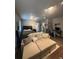 Bright living room featuring a sleeper sofa, ceiling fan, desk, and contemporary decor at 330 45Th S St, St Petersburg, FL 33711