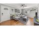 Living room with hardwood floors, gray sectional sofa, and wood coffee table at 330 45Th S St, St Petersburg, FL 33711