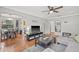 Living room with hardwood floors, gray sectional sofa, and open floor plan at 330 45Th S St, St Petersburg, FL 33711