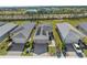 Aerial view of houses with solar panels and community amenities at 44197 Frontier Dr, Punta Gorda, FL 33982