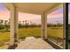 Covered patio overlooks a spacious backyard at 44197 Frontier Dr, Punta Gorda, FL 33982