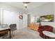 Bright bedroom featuring a cozy armchair, a TV, and built-in closet at 44197 Frontier Dr, Punta Gorda, FL 33982