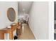 Bright entryway with a wooden console table and a large mirror at 44197 Frontier Dr, Punta Gorda, FL 33982