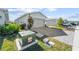 View of the home's electrical box and paved driveway at 44197 Frontier Dr, Punta Gorda, FL 33982