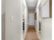 Light and airy hallway with neutral tones and a runner at 44197 Frontier Dr, Punta Gorda, FL 33982