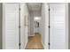 Clean and bright hallway with doors to bedrooms and a bathroom at 44197 Frontier Dr, Punta Gorda, FL 33982