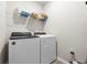Laundry room with Whirlpool washer and dryer, and overhead shelving at 44197 Frontier Dr, Punta Gorda, FL 33982