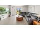 Spacious living room featuring a large sectional sofa and a wooden coffee table at 44197 Frontier Dr, Punta Gorda, FL 33982