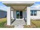 Covered patio with sliding glass doors leading to the backyard at 44197 Frontier Dr, Punta Gorda, FL 33982