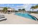 Resort-style swimming pool with lounge chairs and cabanas at 44197 Frontier Dr, Punta Gorda, FL 33982