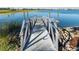 Metal walkway leads to floating dock on calm lake at 44197 Frontier Dr, Punta Gorda, FL 33982