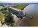 Aerial view of waterfront condo building with pool and boat slips at 900 E Marion Ave # 1403, Punta Gorda, FL 33950