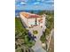 Waterfront condo building with parking and lush landscaping at 900 E Marion Ave # 1403, Punta Gorda, FL 33950