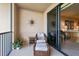 Relaxing balcony with wicker furniture and water views at 900 E Marion Ave # 1403, Punta Gorda, FL 33950