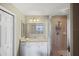Bathroom with walk-in shower and sink at 900 E Marion Ave # 1403, Punta Gorda, FL 33950