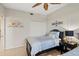 Bright bedroom featuring twin bed, nightstand, and built-in closet at 900 E Marion Ave # 1403, Punta Gorda, FL 33950