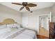 Spacious bedroom with large bed and access to bathroom at 900 E Marion Ave # 1403, Punta Gorda, FL 33950