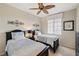 Well-lit bedroom with twin beds, nightstands, and ample closet space at 900 E Marion Ave # 1403, Punta Gorda, FL 33950