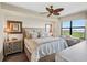 Main bedroom with a king-size bed and water views at 900 E Marion Ave # 1403, Punta Gorda, FL 33950