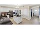 Modern kitchen with island and granite countertops at 900 E Marion Ave # 1403, Punta Gorda, FL 33950