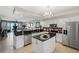 Modern kitchen with island, granite counters and stainless steel appliances at 900 E Marion Ave # 1403, Punta Gorda, FL 33950