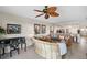 Living room features a curved sofa and water views at 900 E Marion Ave # 1403, Punta Gorda, FL 33950