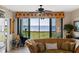 Living room with water views and comfortable seating at 900 E Marion Ave # 1403, Punta Gorda, FL 33950