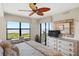 Main bedroom with water view and TV at 900 E Marion Ave # 1403, Punta Gorda, FL 33950