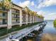 Building with boat slips along calm waterway; tropical feel at 900 E Marion Ave # 1403, Punta Gorda, FL 33950
