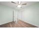 Bedroom featuring neutral walls, hardwood floors, and a closet at 115 Leland Se St, Port Charlotte, FL 33952